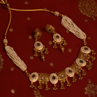 Traditional  Indian style gold plated necklace with red and green stone  set with long earrings